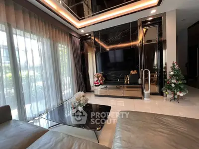 Luxurious modern living room with sleek design and large windows for natural light.