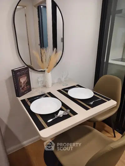 Chic dining nook with modern decor and elegant table setting in a stylish apartment.