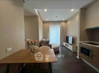 Modern living room with open kitchen and stylish decor