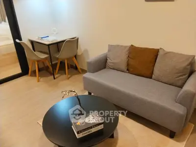 Modern living room with cozy sofa and stylish decor in a contemporary apartment.