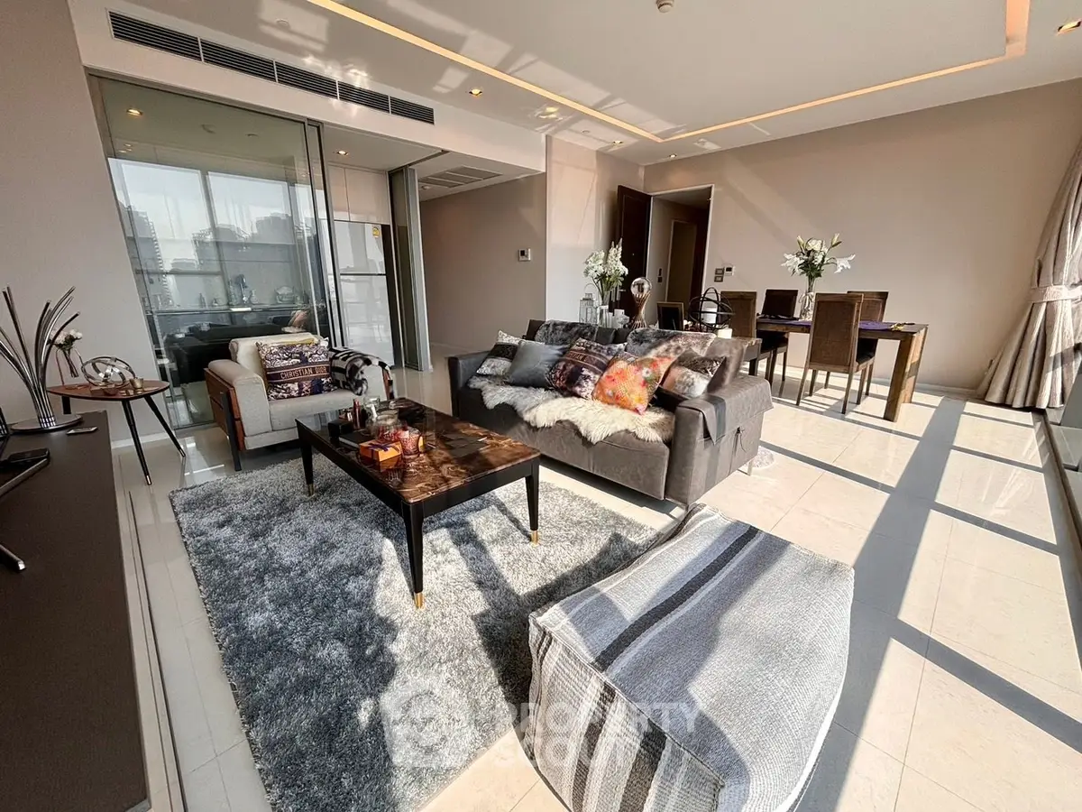 Luxurious living room with modern decor and abundant natural light