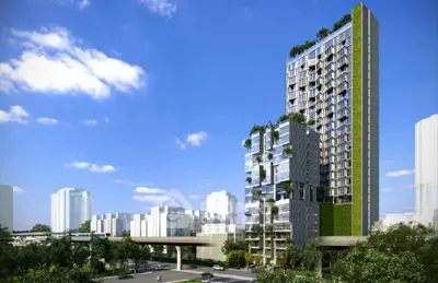 Modern high-rise building with lush greenery and urban skyline view.