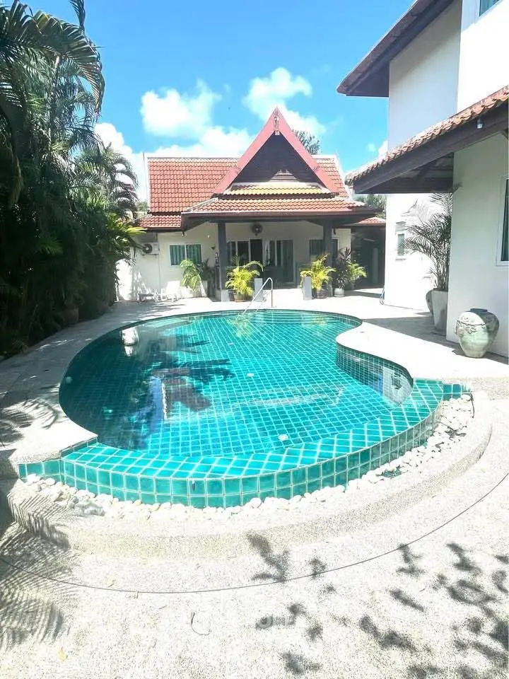 Stunning villa with private pool and lush garden, perfect for luxurious tropical living.