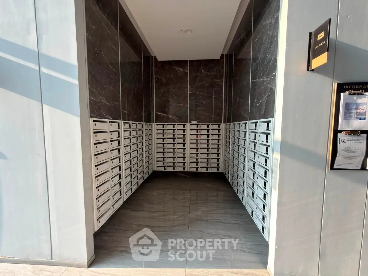 Modern apartment building mailroom with sleek design and ample mailboxes