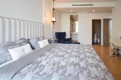 Luxurious bedroom with elegant decor and spacious layout in modern apartment.