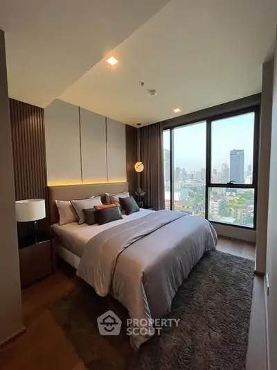 Luxurious bedroom with stunning city view and modern decor