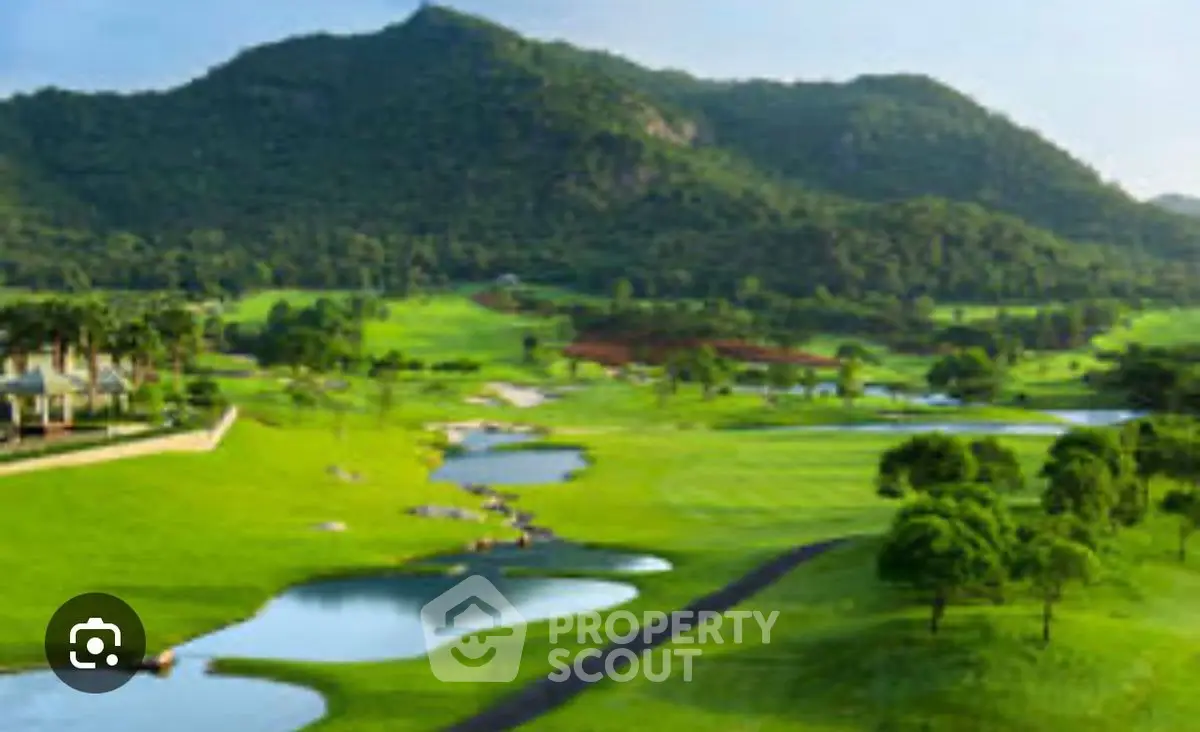 Stunning golf course view with lush greenery and serene water features, perfect for luxury real estate.