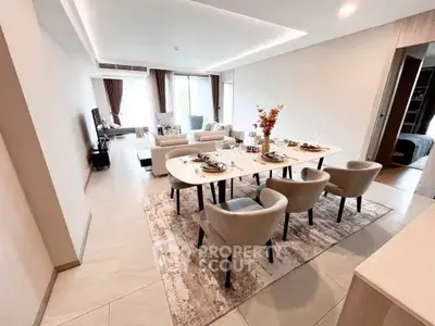 Luxurious open-plan living and dining area with elegant decor and modern furniture.