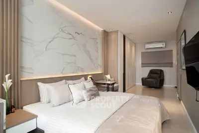 Luxurious modern bedroom with elegant decor and ambient lighting