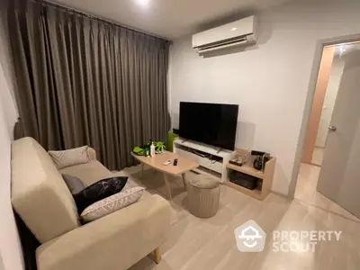 Cozy living room with modern decor and air conditioning