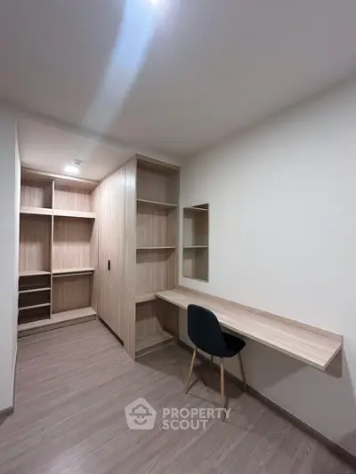 Modern study room with built-in shelves and sleek desk