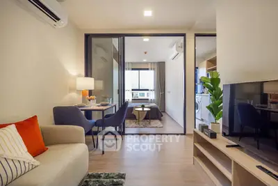 Modern living room with open layout and stylish decor in a contemporary apartment.
