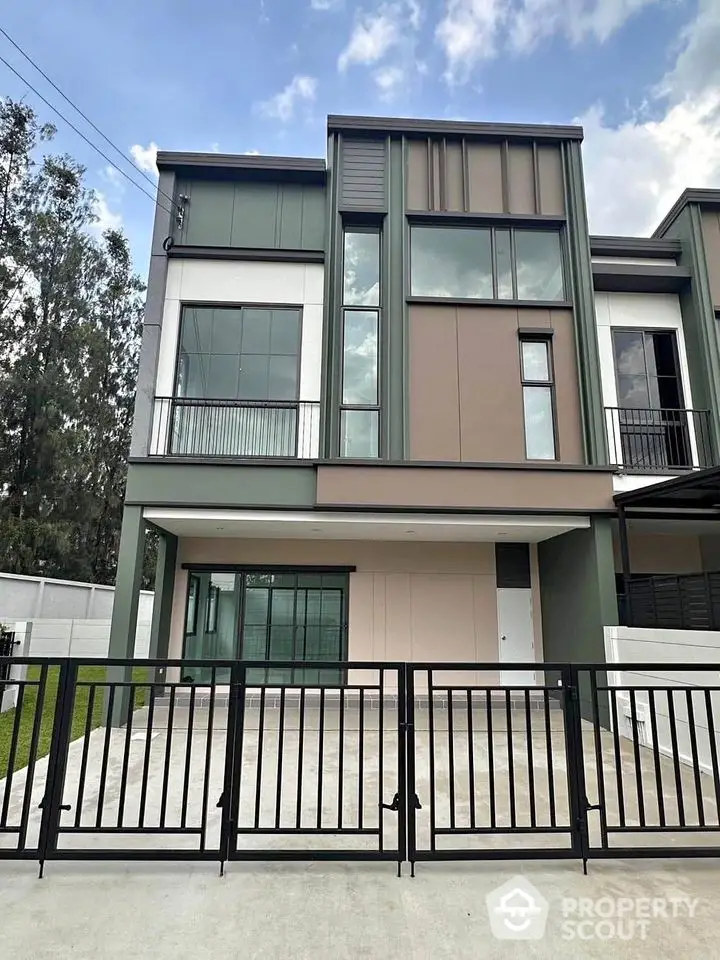 Modern two-story house with sleek design and spacious driveway