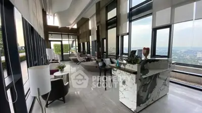 Luxurious high-rise lounge with panoramic city views and elegant marble decor.