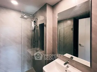 Modern bathroom with sleek shower and elegant mirror design