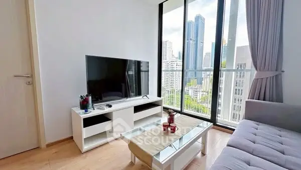 Modern living room with city view, featuring sleek furniture and large windows.