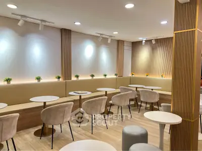 Modern cafe interior with stylish seating and ambient lighting, perfect for social gatherings.