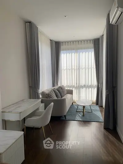 Elegant living room with modern decor, featuring a cozy sofa, stylish curtains, and a chic coffee table.