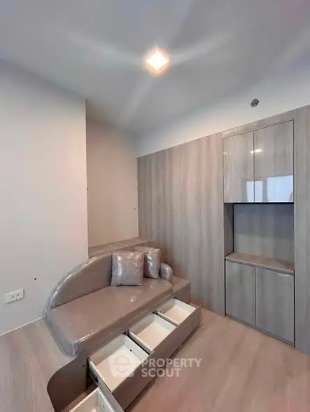 Modern living room with built-in storage and sleek design