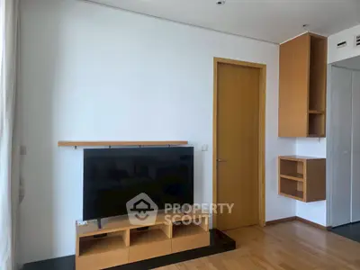 Modern living room with sleek wooden TV stand and minimalist design