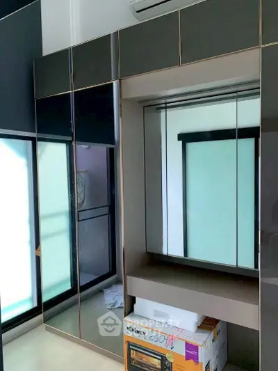 Modern wardrobe with mirrored doors in a stylish bedroom setting