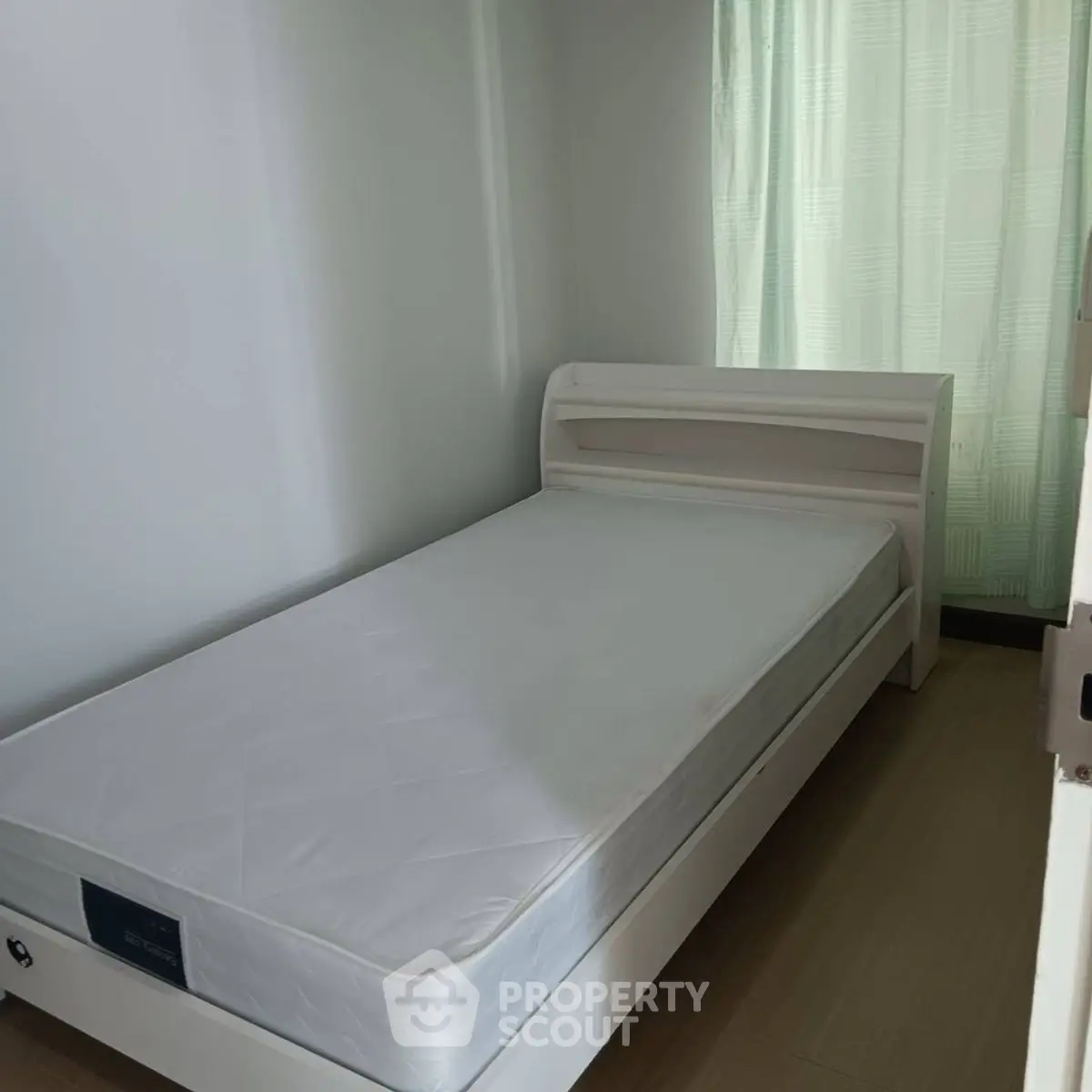 Cozy minimalist bedroom with natural light and simple decor