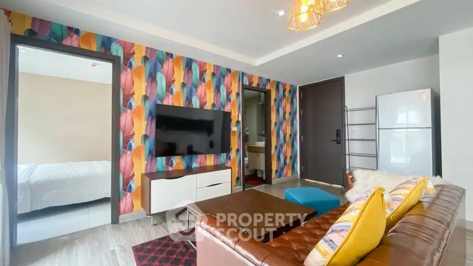 Vibrant living room with colorful wallpaper and modern furnishings