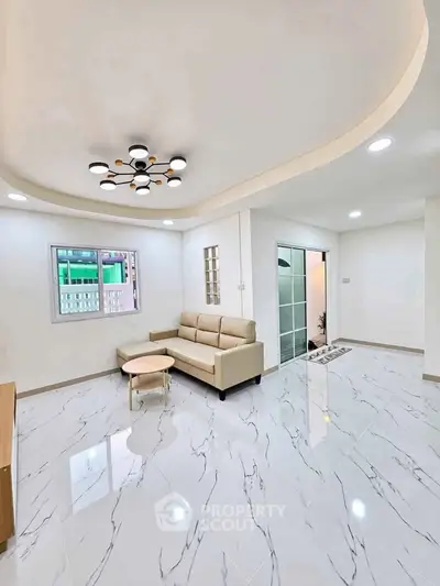 Modern living room with elegant lighting and marble flooring