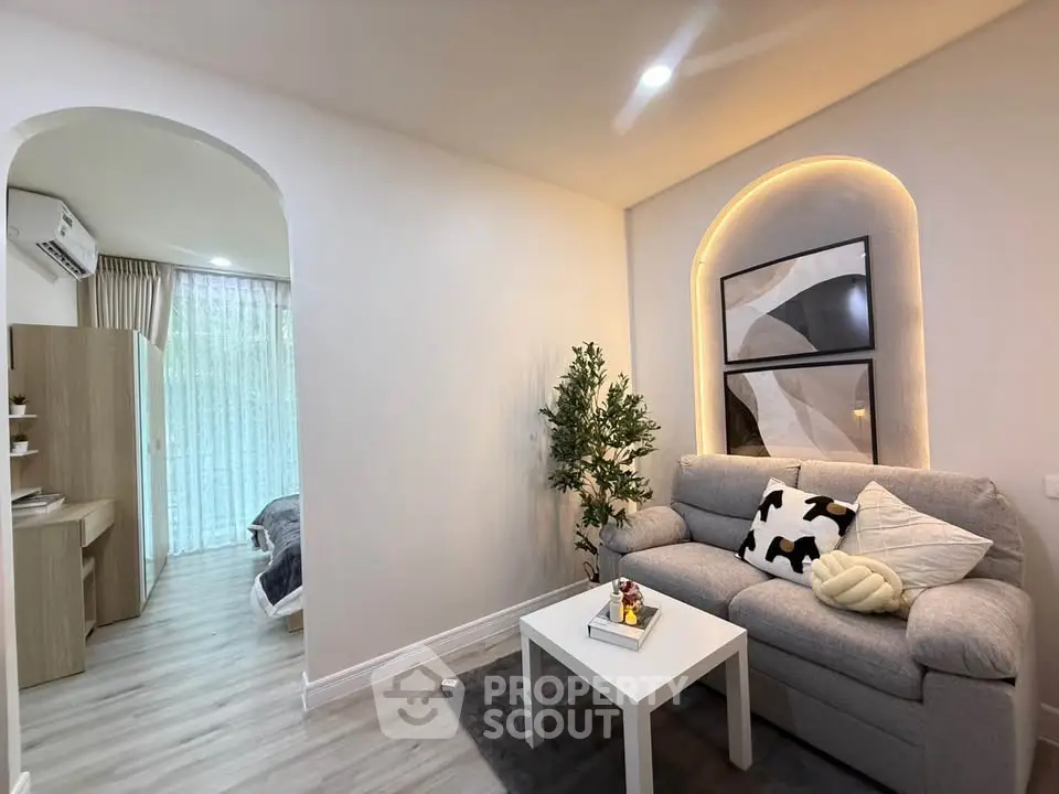 Modern living room with cozy sofa and stylish decor in a bright apartment