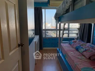 Charming bedroom with bunk beds and city view, perfect for kids or guests.