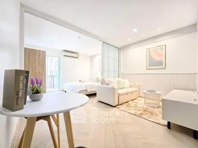 Modern open-plan living room with cozy seating and stylish decor