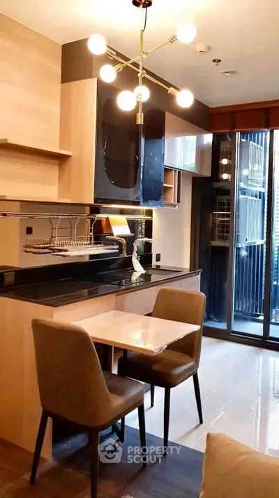 Modern kitchen with sleek design and dining area in stylish apartment