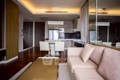 Modern open-plan living room with sleek kitchen and elegant dining area