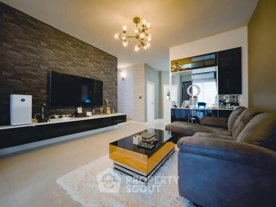 Modern living room with stylish decor, plush sofa, and sleek entertainment center.