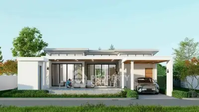 Modern single-story house with sleek design, large windows, and a carport, surrounded by lush greenery.