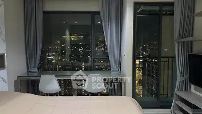 Modern bedroom with city view, featuring sleek furniture and floor-to-ceiling windows.