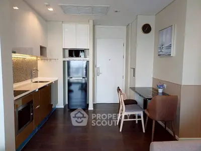 Modern kitchen and dining area with sleek appliances and stylish decor