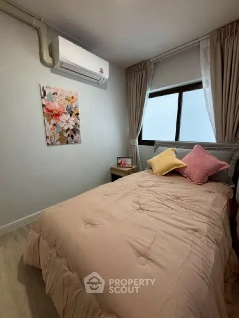 Cozy bedroom with air conditioning and soft pastel decor