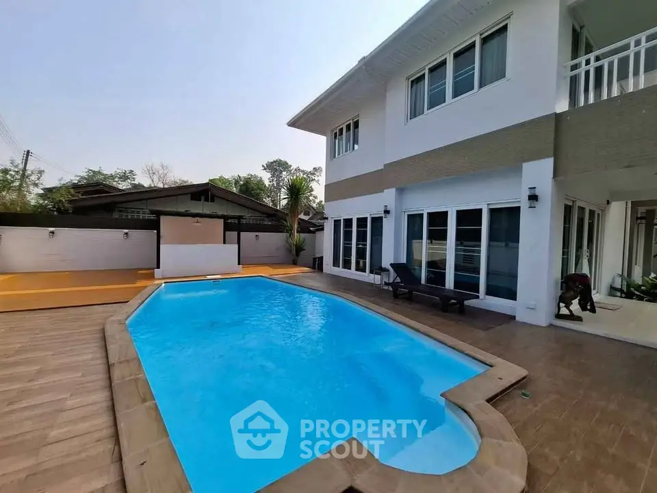 Luxurious two-story home with private pool and spacious patio, perfect for relaxation and entertainment.