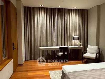 Elegant bedroom with modern furniture and stylish curtains