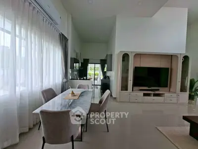 Spacious modern living room with elegant dining area and large windows