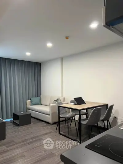 Modern living room with sleek furniture and open layout, perfect for urban living.