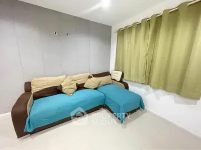 Cozy living room with modern sofa and stylish curtains