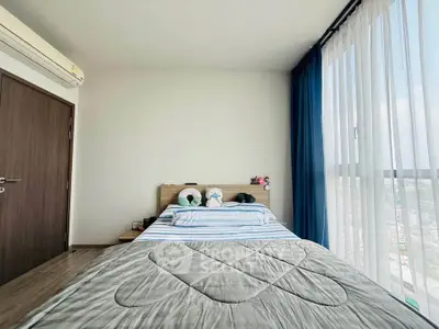 Bright and airy bedroom with large windows and modern decor