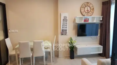 Modern living room with stylish decor and wall-mounted TV
