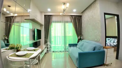 Modern living room with stylish decor and balcony view in a high-rise apartment.