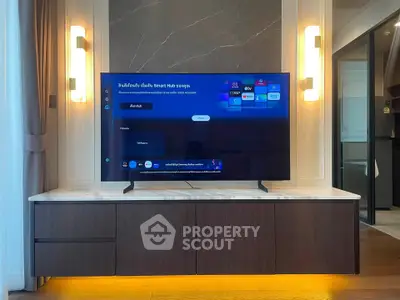 Modern living room with sleek TV unit and ambient lighting