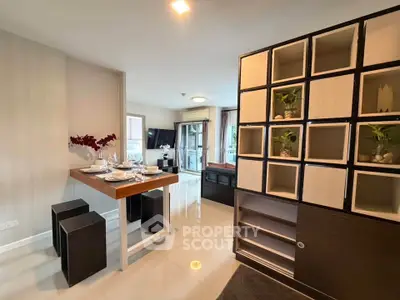 Modern open-plan living room with stylish dining area and contemporary decor.