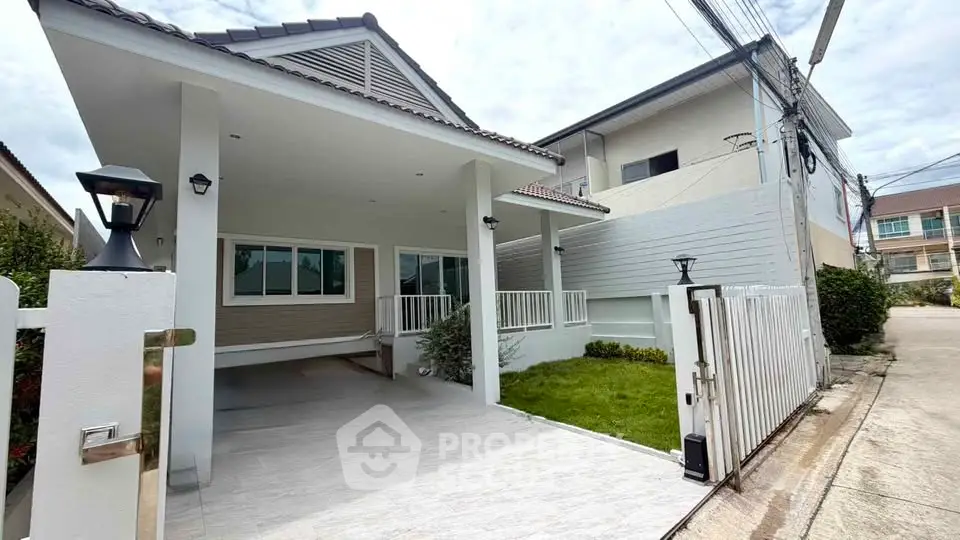 Charming modern house with spacious driveway and lush green lawn in a serene neighborhood.