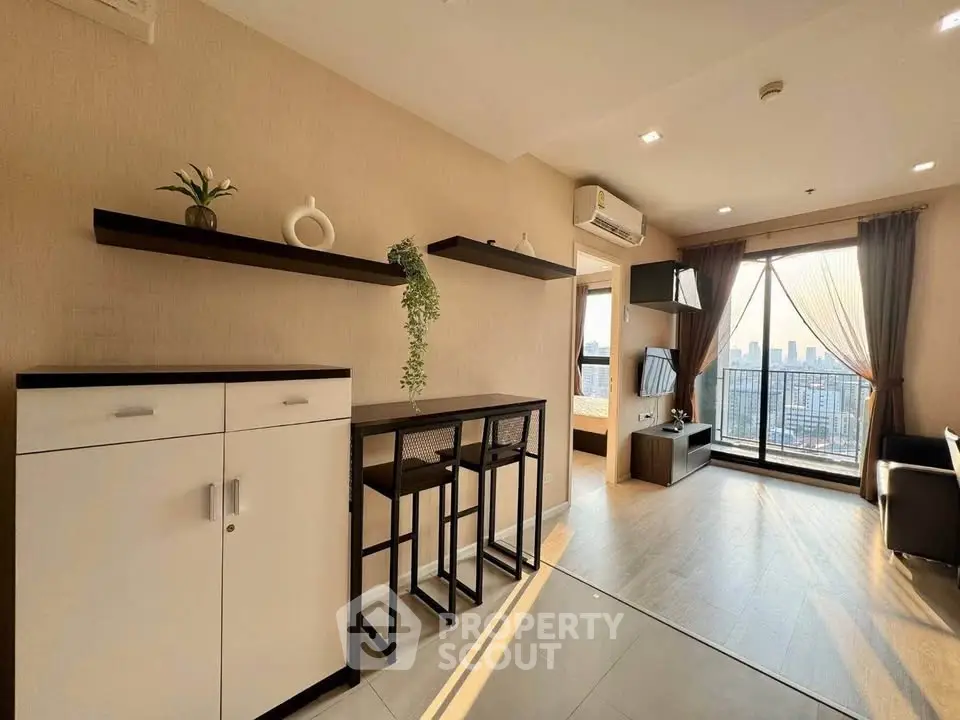 Modern living room with city view, stylish decor, and natural light.